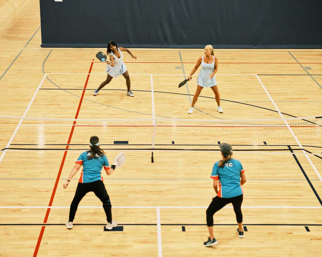 Sondra Boruty, 58, (top left) and Tania Miller, 57, (top right) return the ball to their opponents as they compete in their doubles match at the Florida Senior Games.
