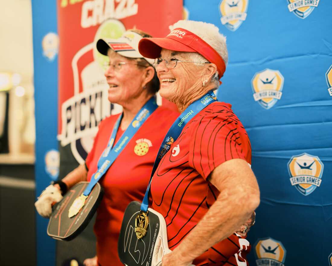 Ruth Weil, 76, (right) receives her gold medal at the Florida Senior Games. She will play in the national games in 2025.