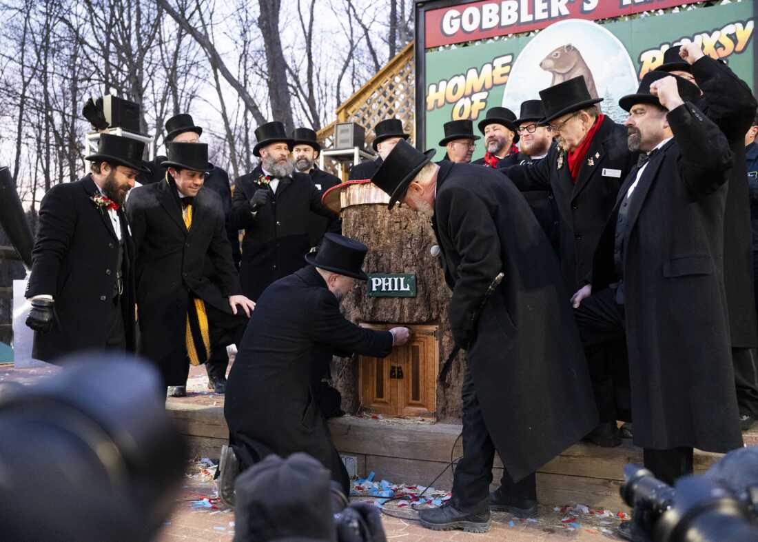 Members of the Inner Circle wake up Punxsutawney Phil to give his annual winter forecast.