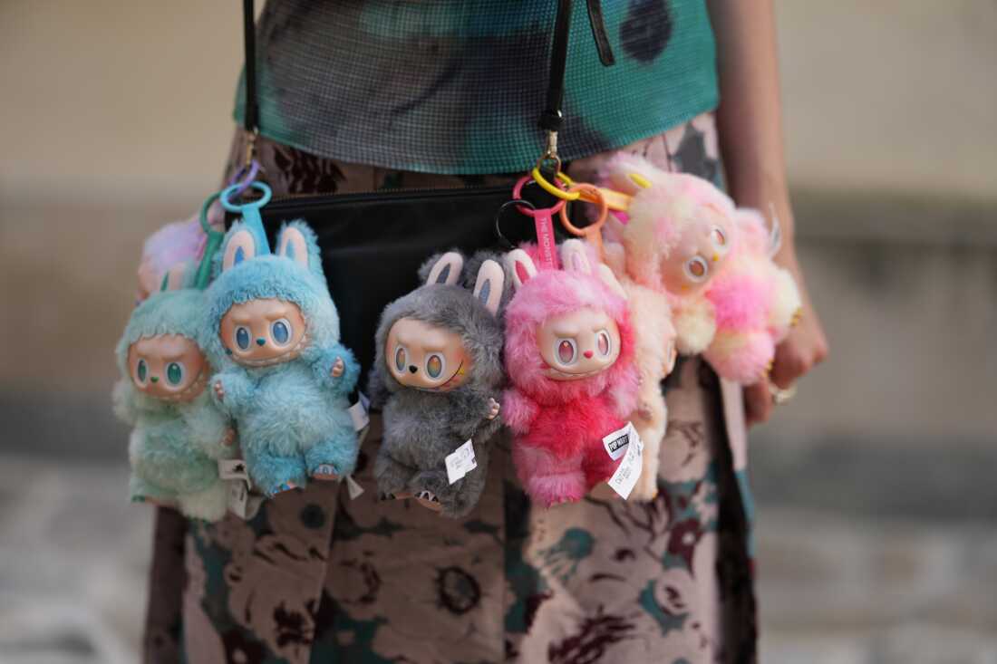 Close-up detail view of seven Labubu monsters during a street style fashion photo session, on June 12 in Paris, France.