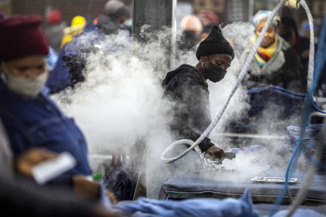 Garment factory workers iron jeans on July 3, 2025 in Maseru, Lesotho. The tiny country is Africa's denim hub, now threatened by Trumps tariffs.