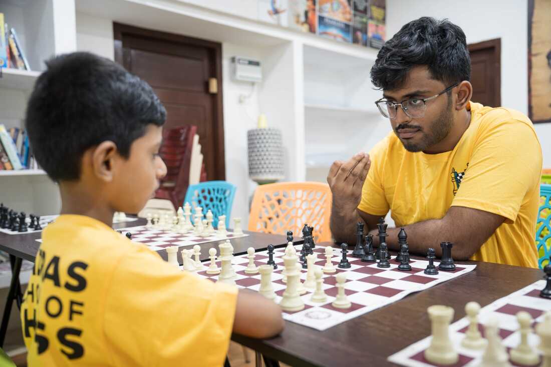 Selvabharathy, a trainer at the Madras School of Chess, coaches seven-year-old Lakshan.