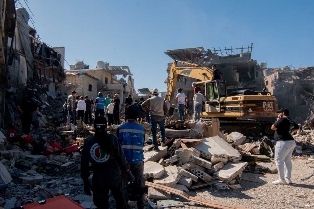 Civilians and rescue teams work together to clear the rubble and search for survivors after the Israeli airstrike near Rafik Hariri University Hospital. The number of people killed in the airstrike carried out by Israel increased to 30. Beirut, Lebanon, October 22, 2024.