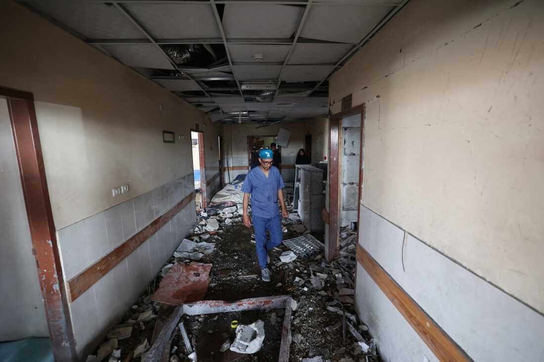 Palestinian hospital staff inspect the destruction inside Nasser hospital in Khan Yunis in the southern Gaza Strip, following an Israeli strike early on May 13, 2025 in which a Palestinian journalist was killed along with several others.
