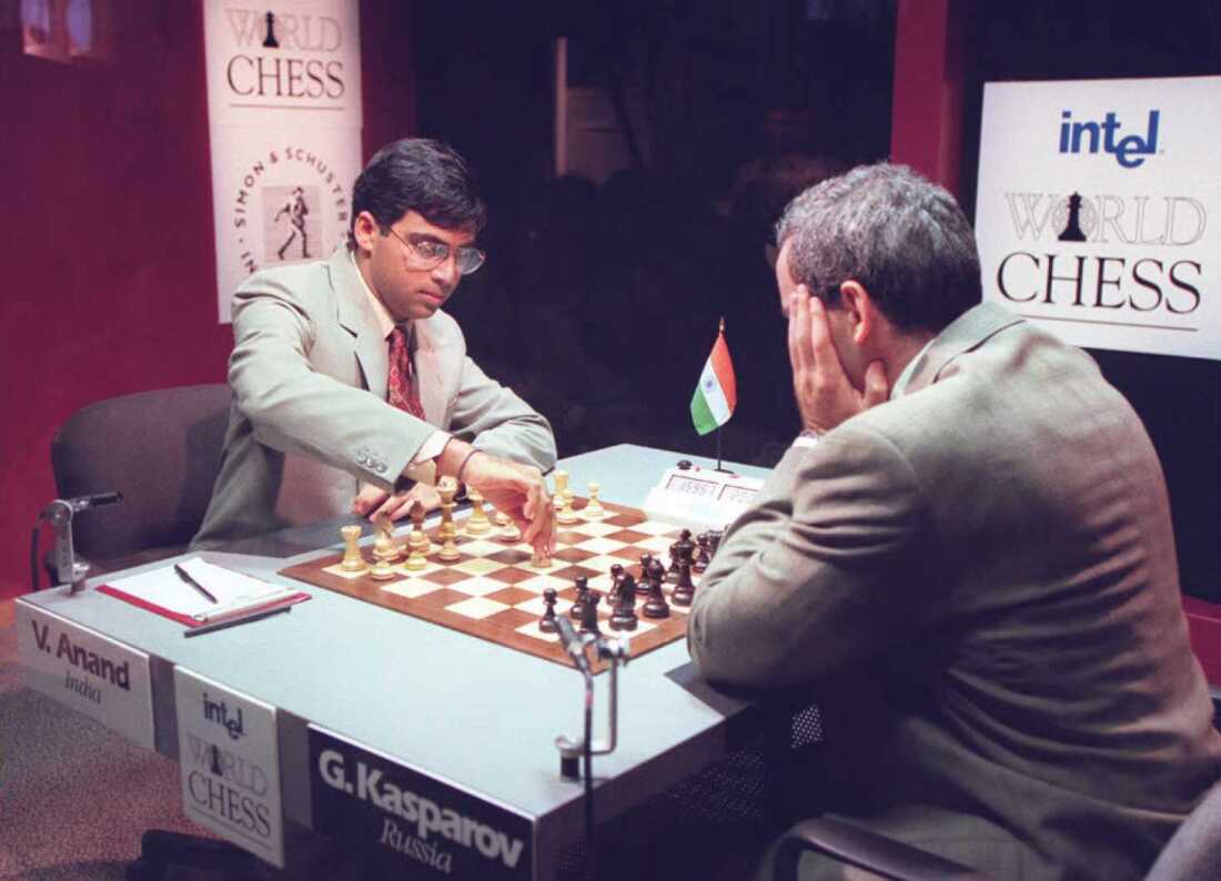 Vishwanathan "Vishy" Anand of India makes the opening move as World Chess Champion Gary Kasparov of Russia watches in their championship match on September 21, 1995 in New York.