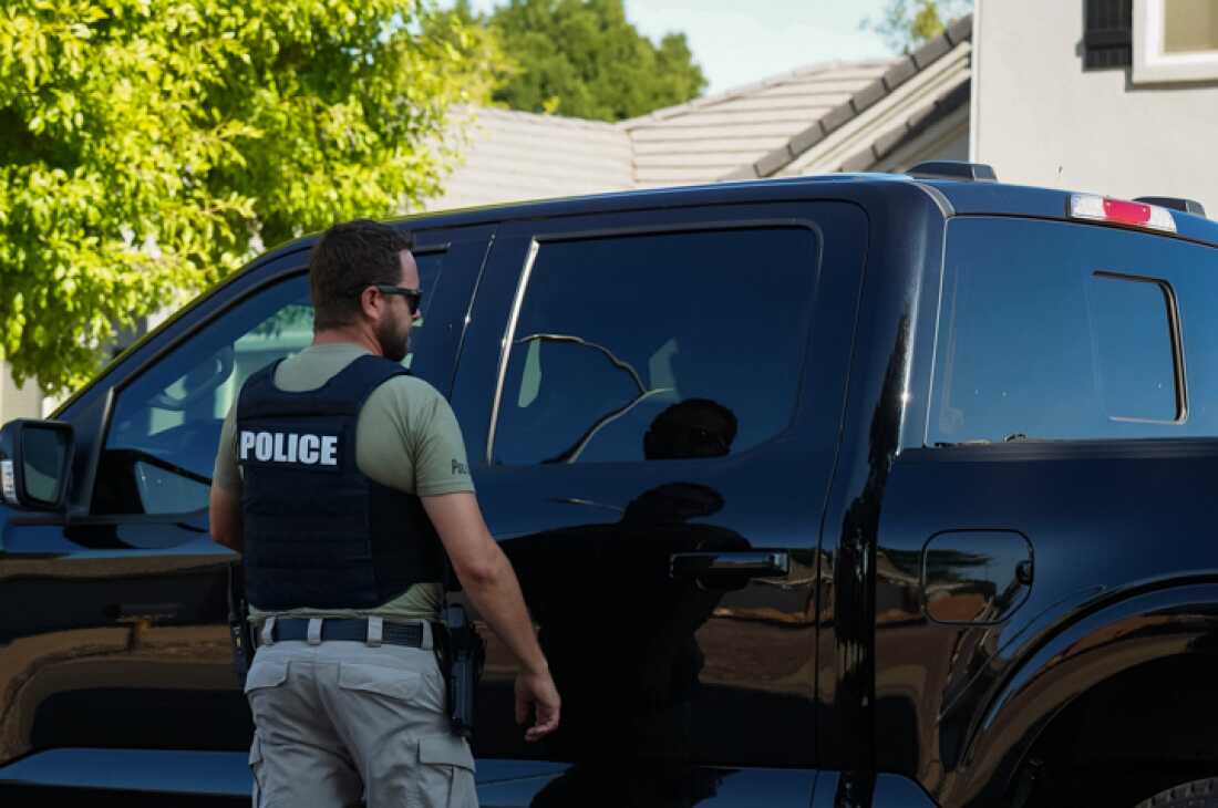 Washington County Sheriff's Office and Washington city police gather outside the Robinson family home in Washington, UT. Tyler Robinson is the current suspect in the Charlie Kirk assassination that took place Wednesday.
