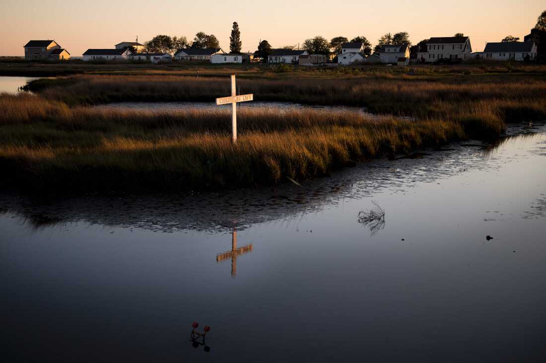 A cross reading "Christ is Life" on a waterway in Tangier.