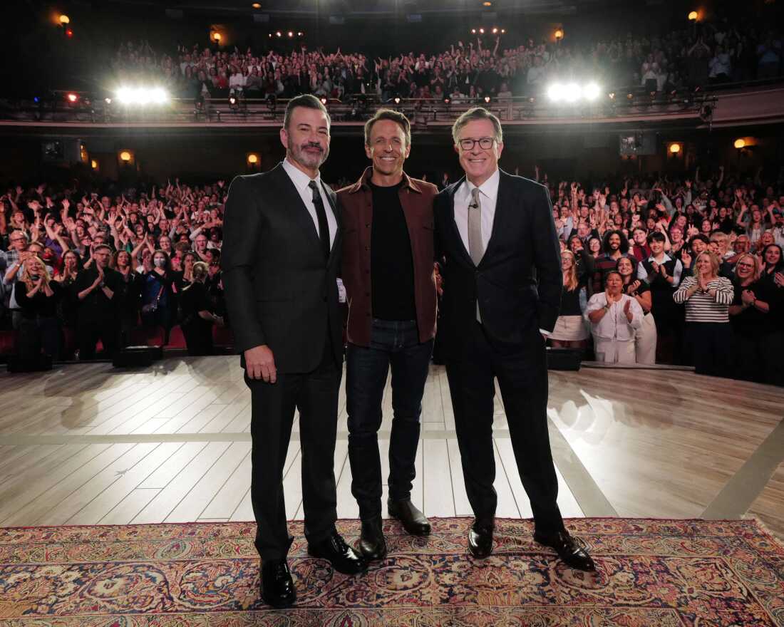 Stephen Colbert (right) and Jimmy Kimmel (left) appeared as guests on each other's shows on Tuesday, Sept. 30. Seth Meyers (center) also appeared on Kimmel's show that night. All three hosts have faced ire from President Trump.