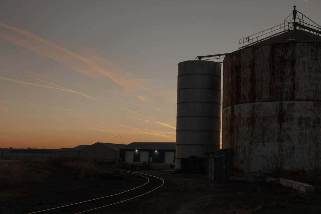 A factory plant sits at dusk, Saturday, Dec. 21, 2024, in Fremont, Nebraska. Immigrant workers, primarily from El Salvador and Guatemala, have been moving to Nebraska, where there are multiple factories and jobs. State-wide, Nebraska is experiencing labor shortages, publicly declaring themselves as welcoming to immigrants. The state voted in its majority for President Trump, who campaigned on plans of mass deportation. (Lexi Parra for NPR)