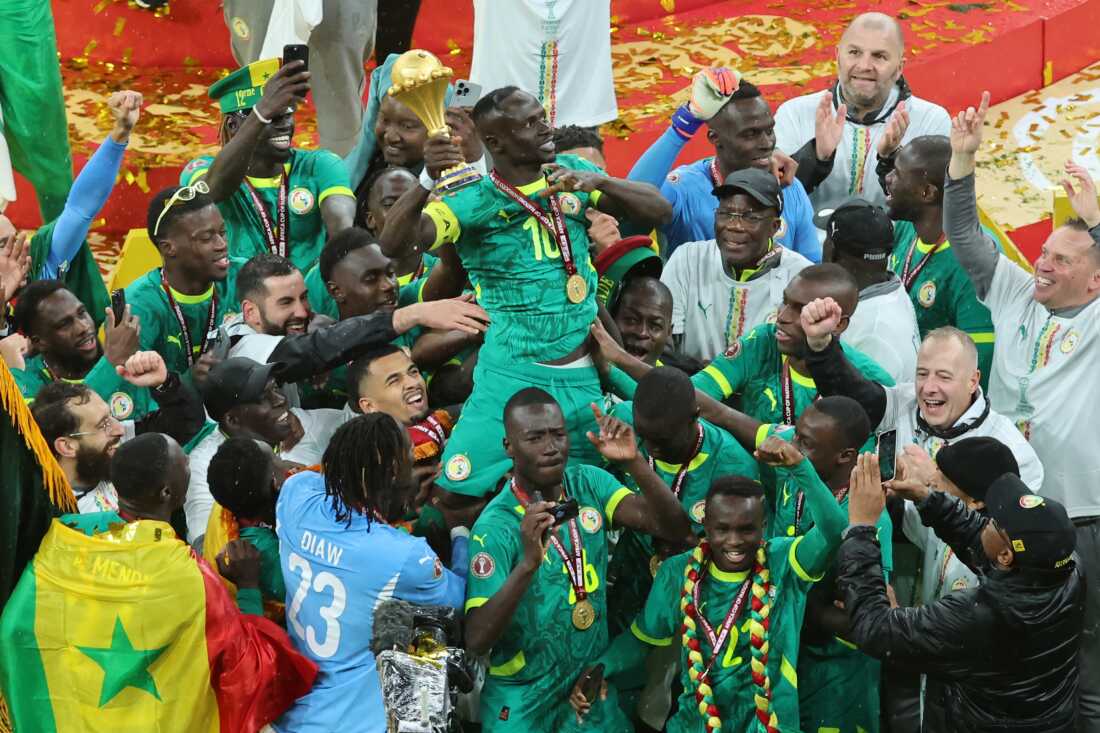 Senegal's Sadio Mane holds the trophy aloft as he celebrates with teammates after winning the Africa Cup of Nations final soccer match between Senegal and Morocco in Rabat, Morocco, Sunday, Jan. 18, 2026.