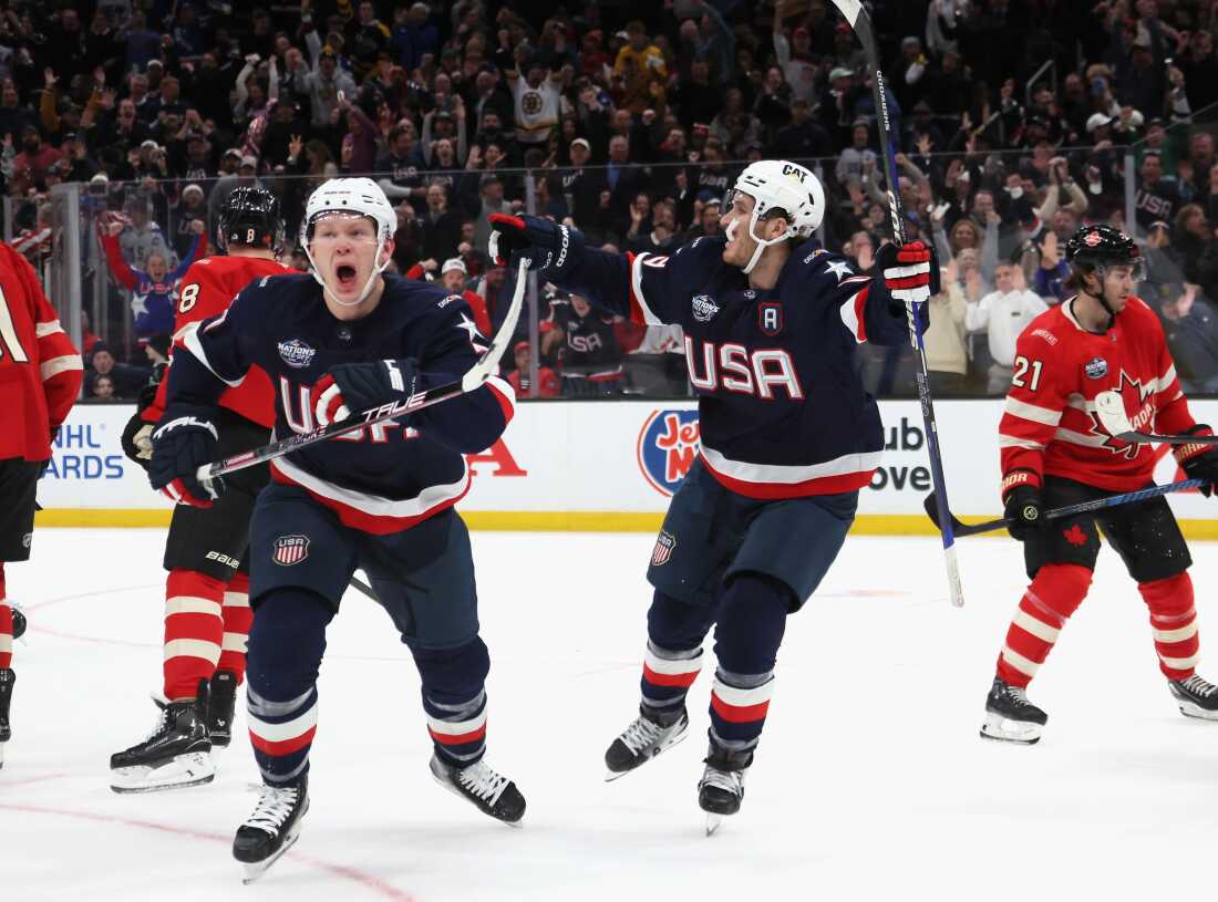 Brothers Brady and Matthew Tkachuk celebrate on the ice in 2025. 