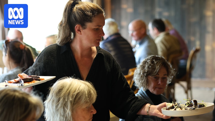 Sarah Bensen serving guests at Brickendon Estate's long-table Sunday lamb roast