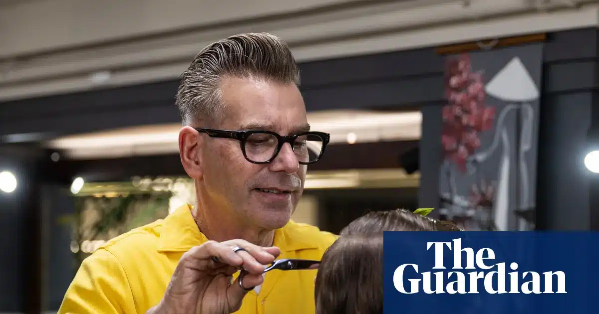 Phil Yates cutting a modern mullet for his son Charlie at Hava & Co barbershop in Auckland
