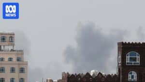 Smoke rising over Sanaa International Airport after a reported air strike on the runway