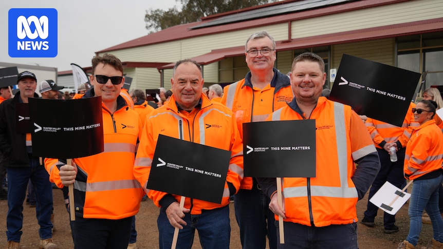 Workers and activists rally outside an IPC hearing over the Hunter Valley Operations mine extension