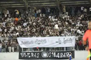 Shabab Al-Khaleel supporters holding a large banner thanking Egypt coach Hossam Hassan inside the stadium