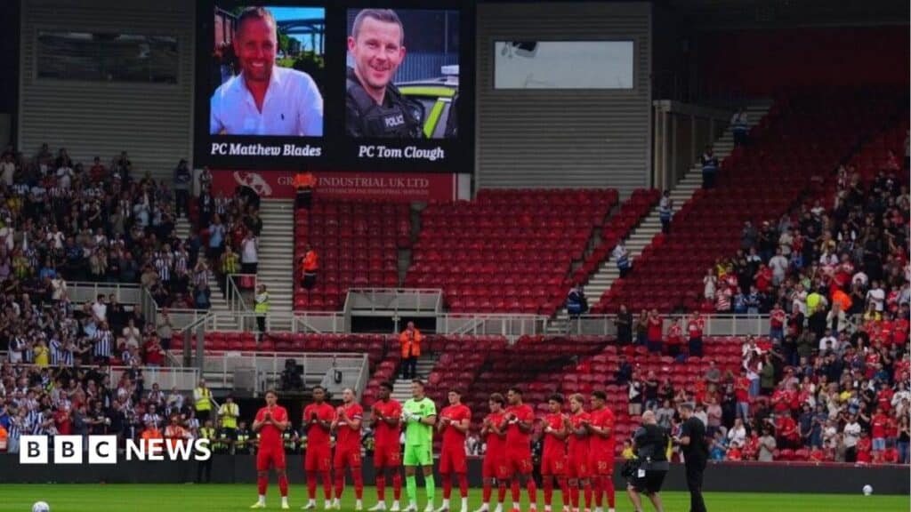 Football fans honour officers killed in A66 crash