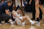 Hawks Beat Bulldogs as Bates Suffers Leg Injury
